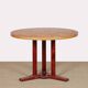 Round wooden dining table from the 1980s.
