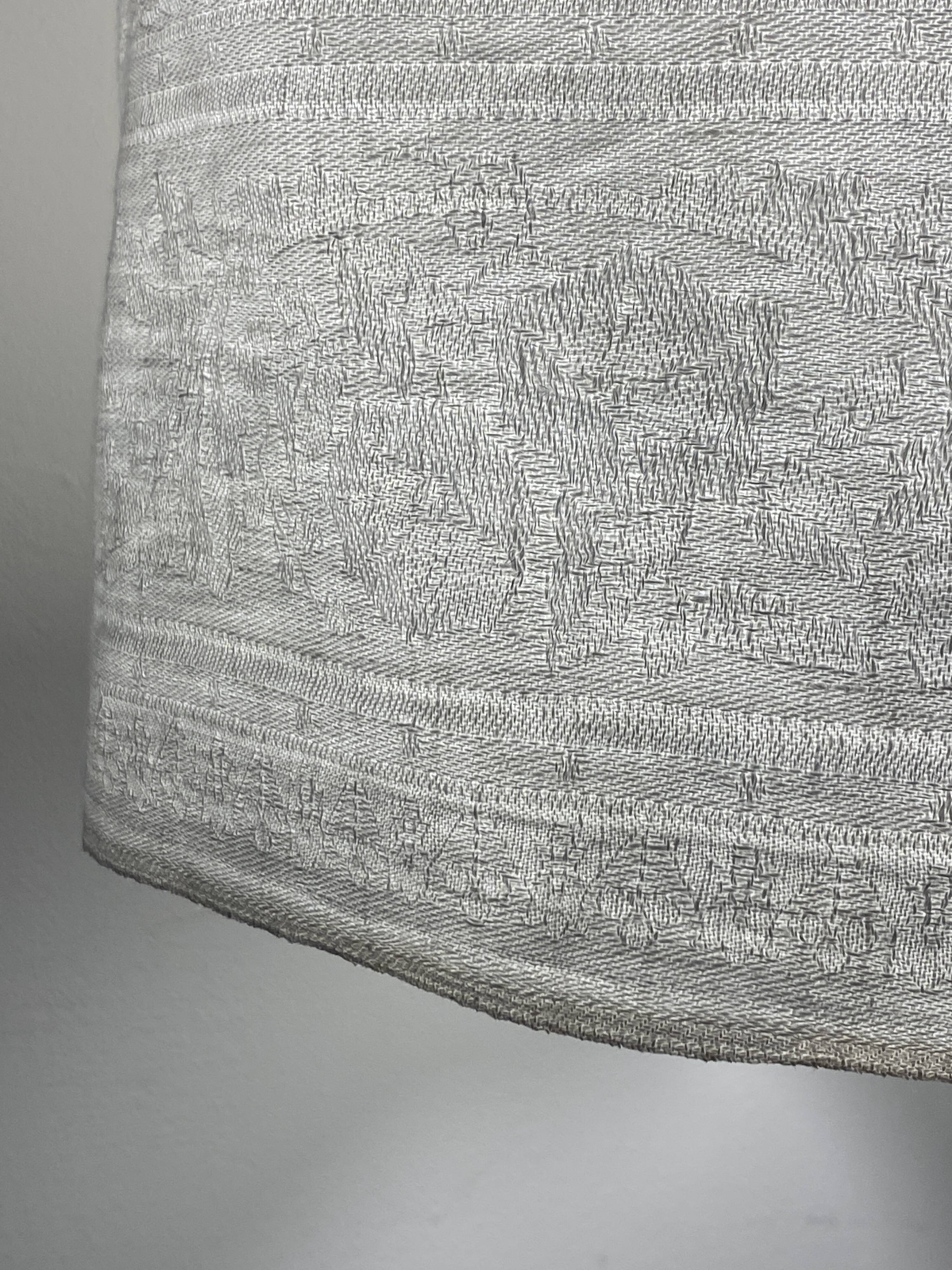 Old linen drapery with monogram and bird by Georges Braque