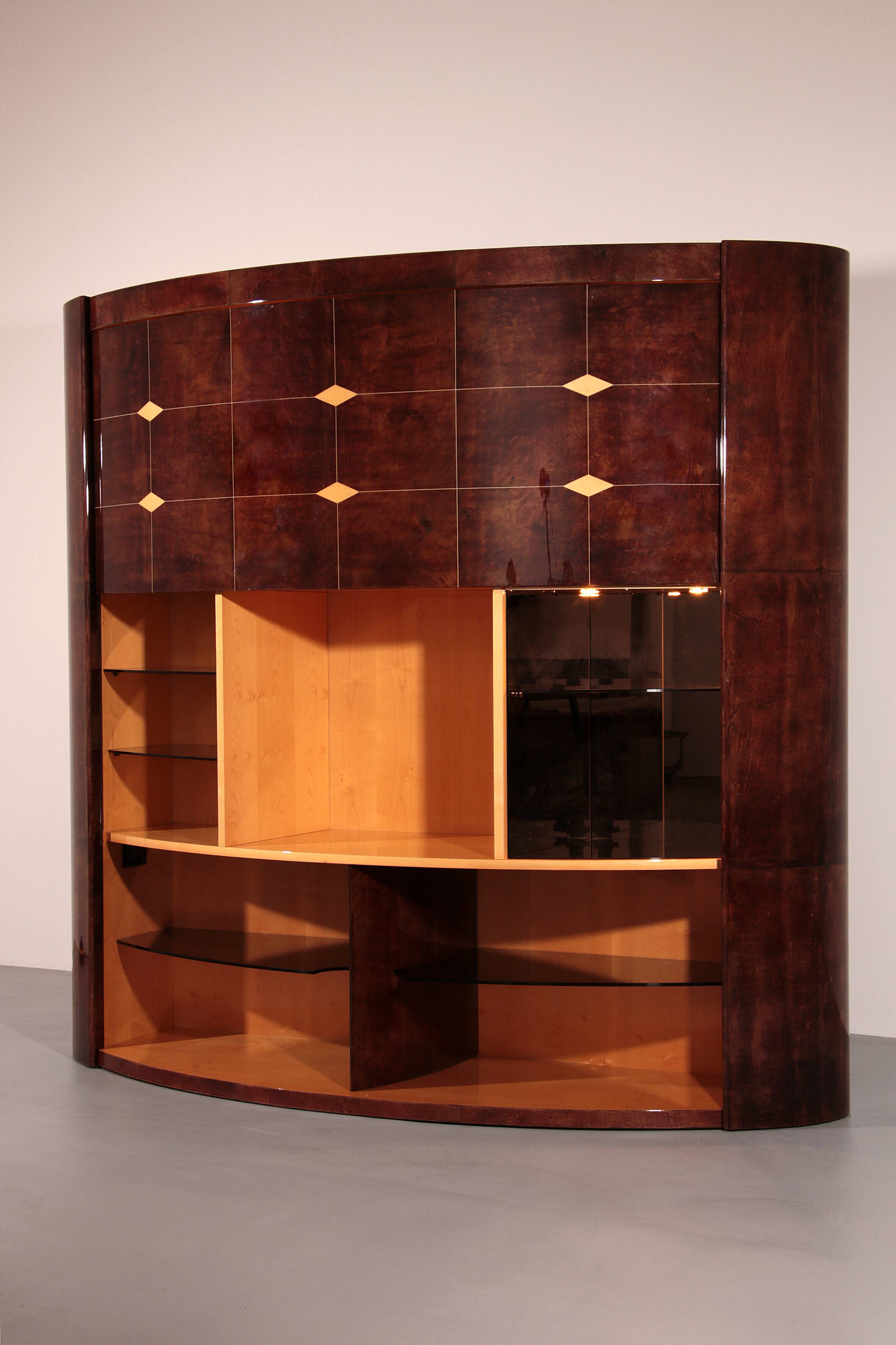 Iconic Aldo Tura brown goatskin bar cabinet with electric lift & mirror interior.