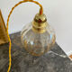 Vintage amber glass suspension globe