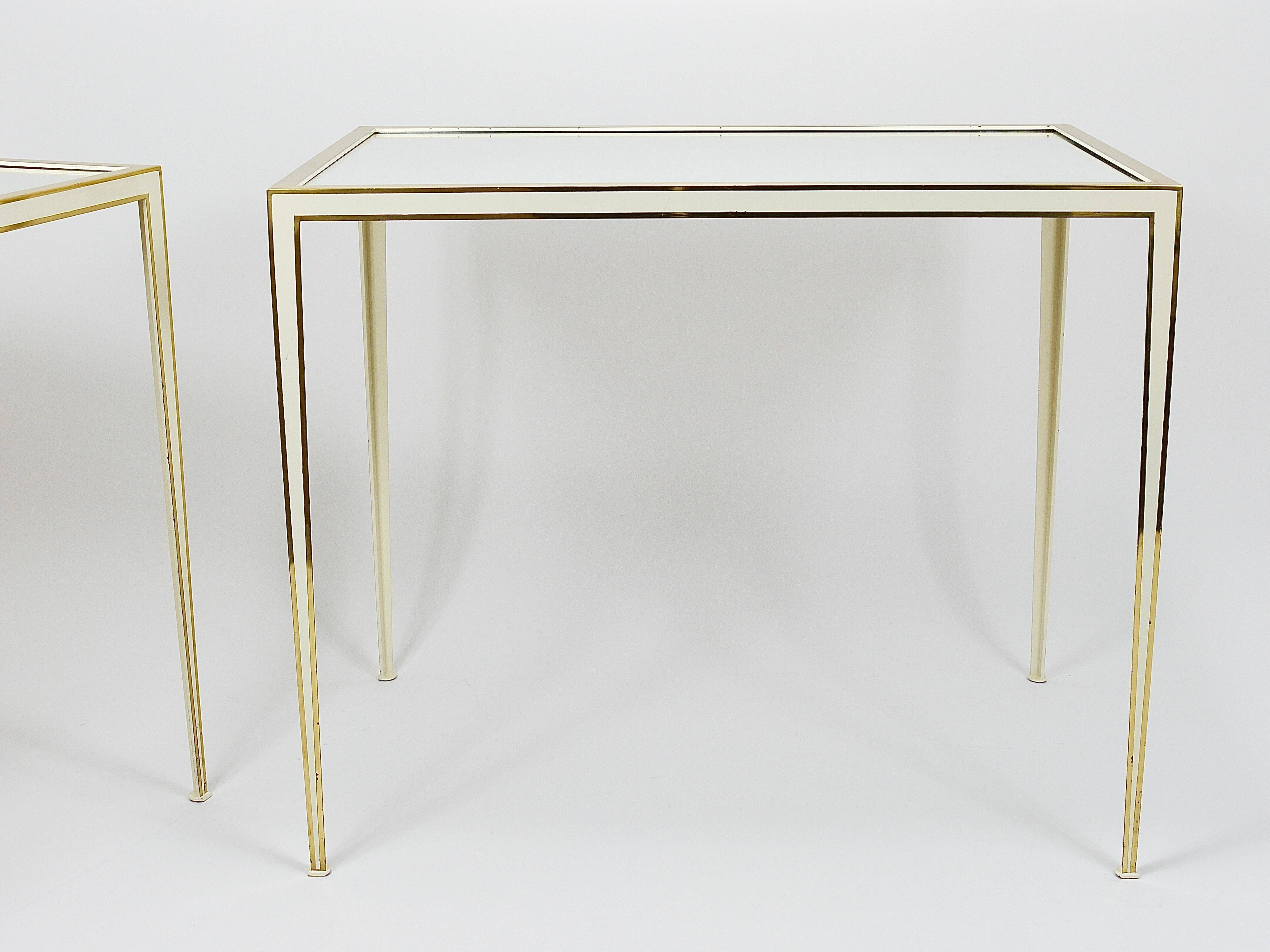 A pair of brass and white mirror tables from Vereinigte Werkstätten, Germany, 1970s.