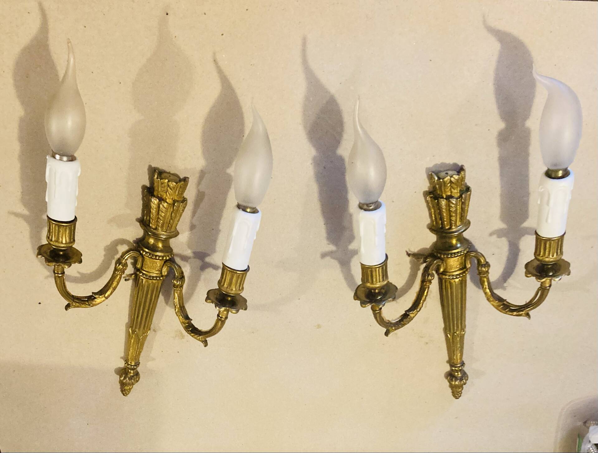 Louis XVI bronze wall sconces from the 19th century with quiver decorations.