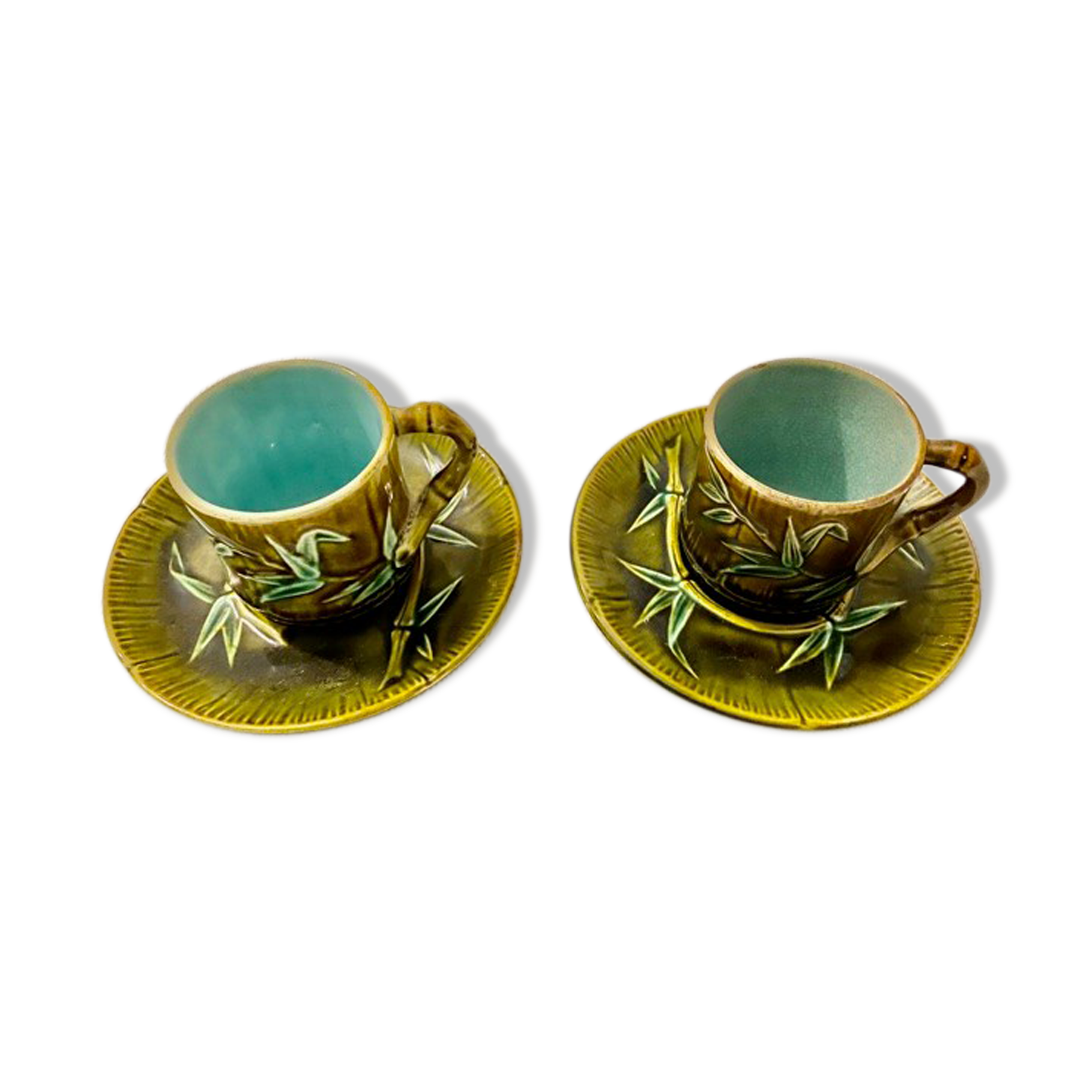 Set de deux tasses et sous tasses en barbotine "bambou" xixème siècle.
