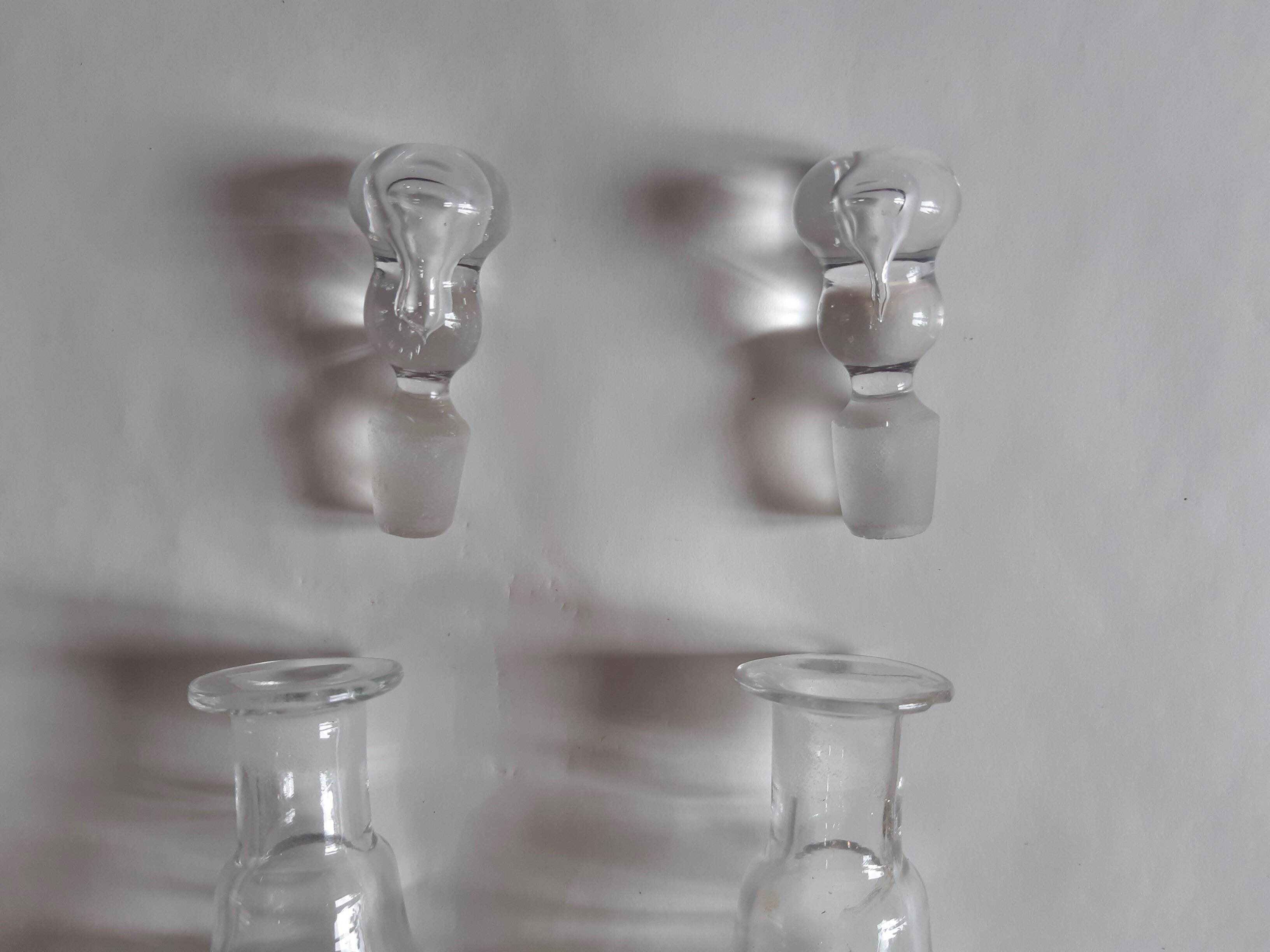 Set of two oil and vinegar glass cruets.