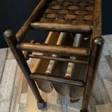 Vintage rattan magazine rack on wheels