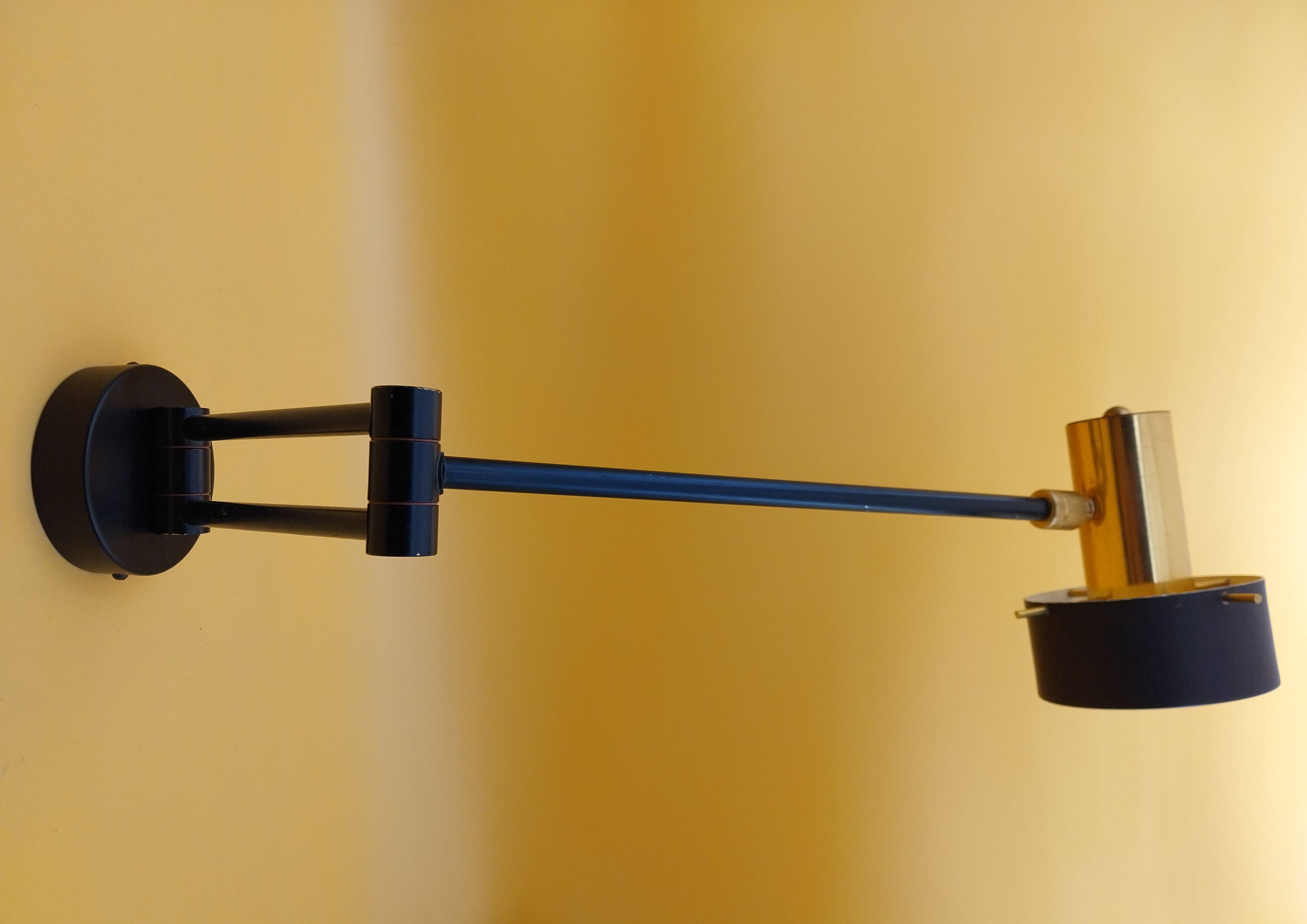 Black metal and brass wall light.