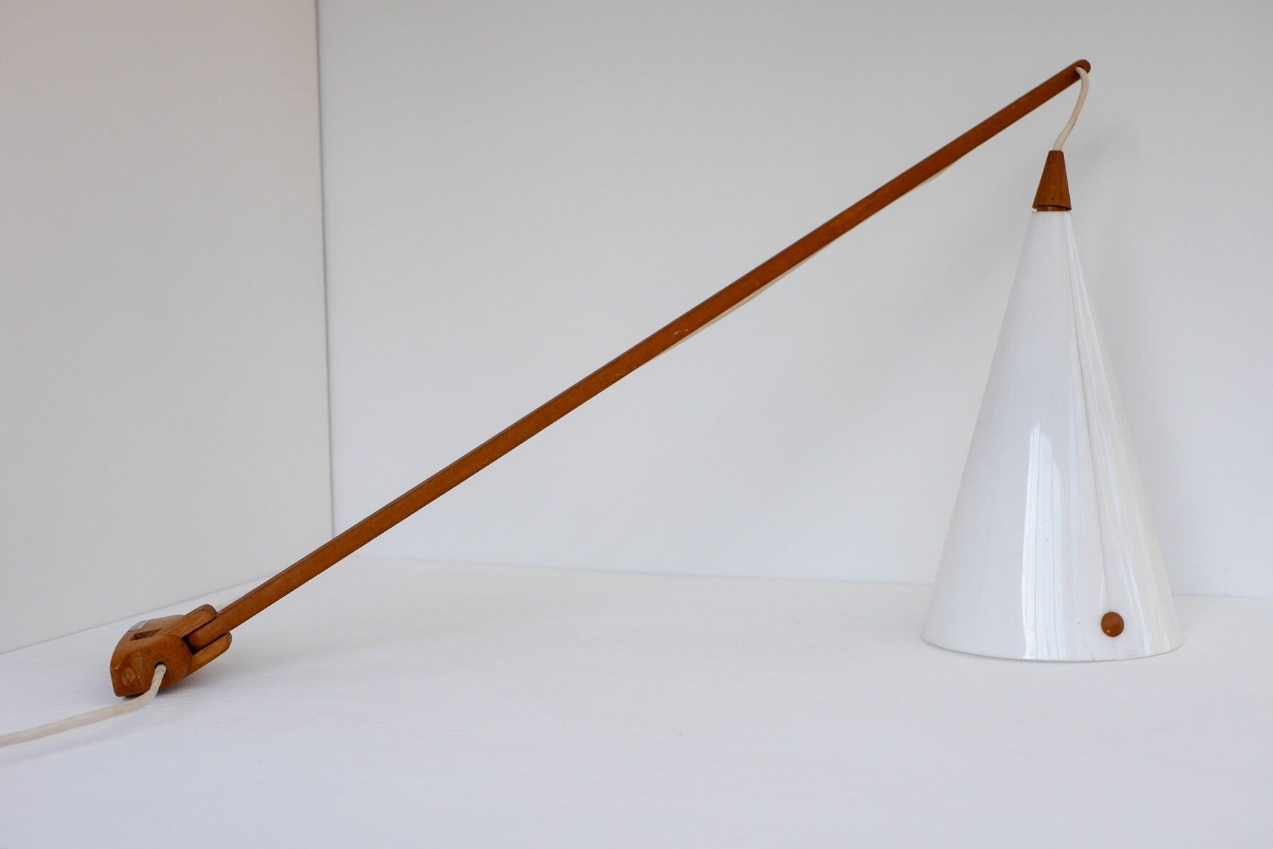 Mid-century Swedish wall lamp in teak by Uno and Östen Kristiansson for Luxus, 1960s