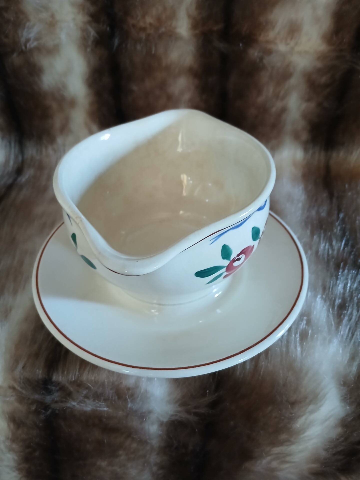 Antique sauce boat in Longchamp ironstone.