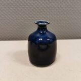 A small vase with blue running glaze with a ‘thin’ neck, from Swedish Kjell Sunesson