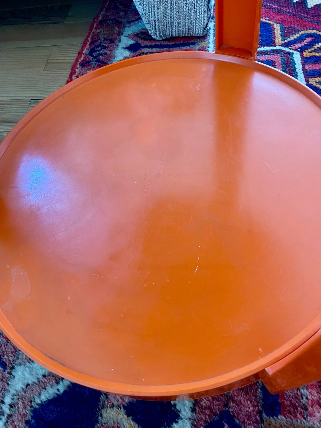 Round orange plastic side table 1970