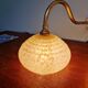 Pair of brass and yellow/white speckled glass wall sconces