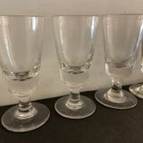 12 old glasses on foot at bistro or absinthe