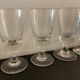 12 old glasses on foot at bistro or absinthe
