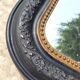Antique mirror in Napoléon III style, blackened with beaded frieze, 42x55cm.