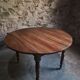 Antique drop-leaf dining table in walnut, France, circa 1900.