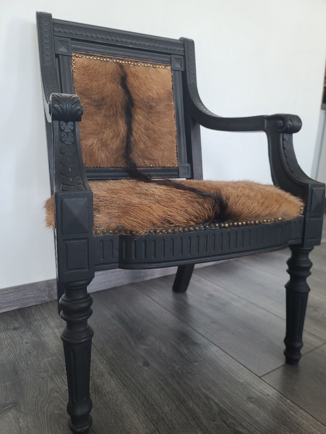 Character armchair in black wood and animal skin #CHMR