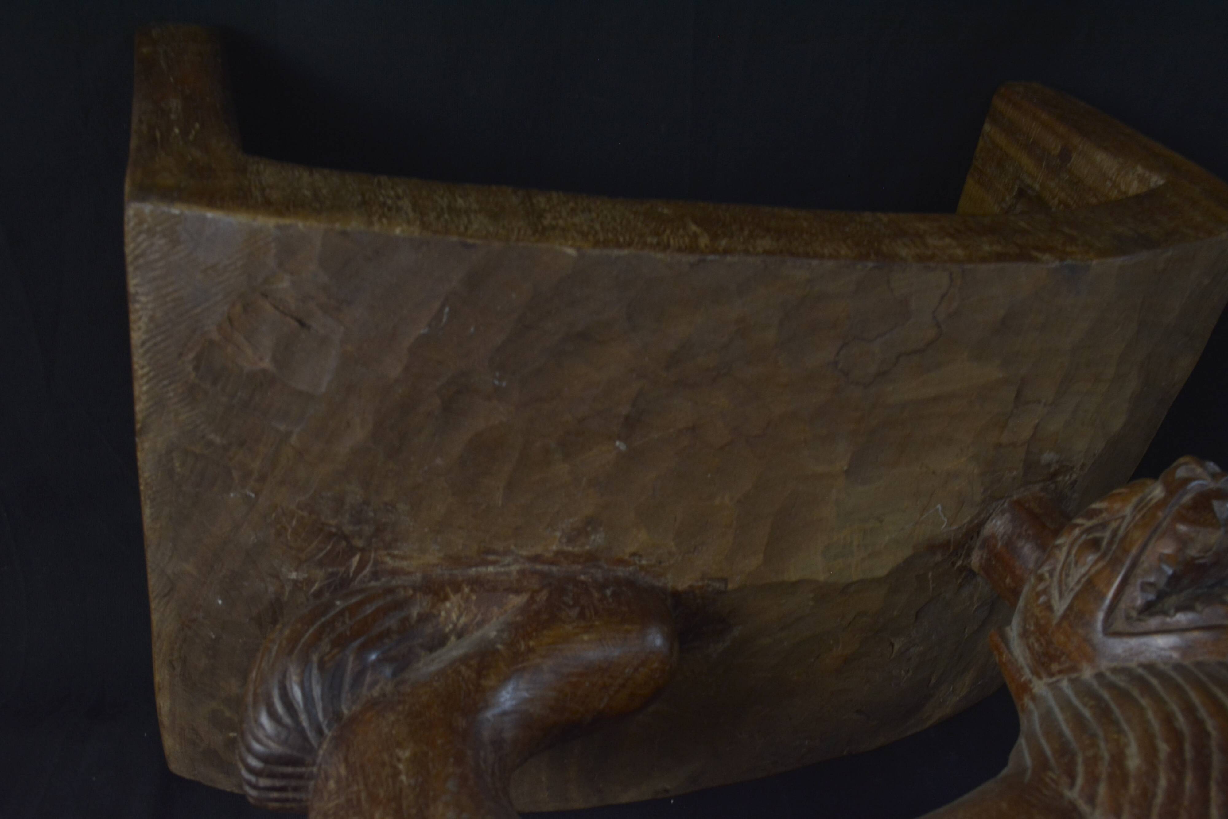 Togolese ethnic stool in carved exotic wood.