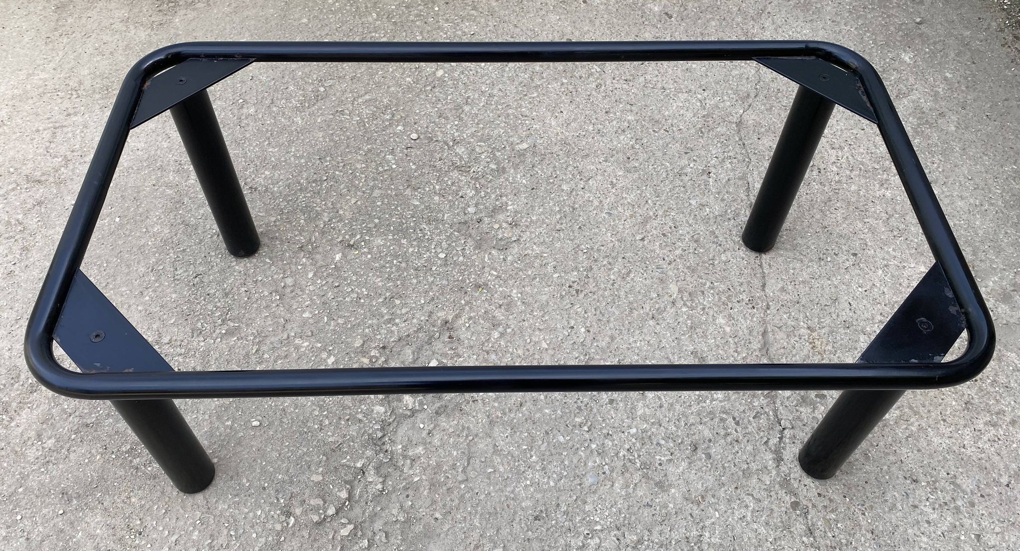 Vintage black tubular coffee table with smoked glass by Yves Boutboul, 1980.