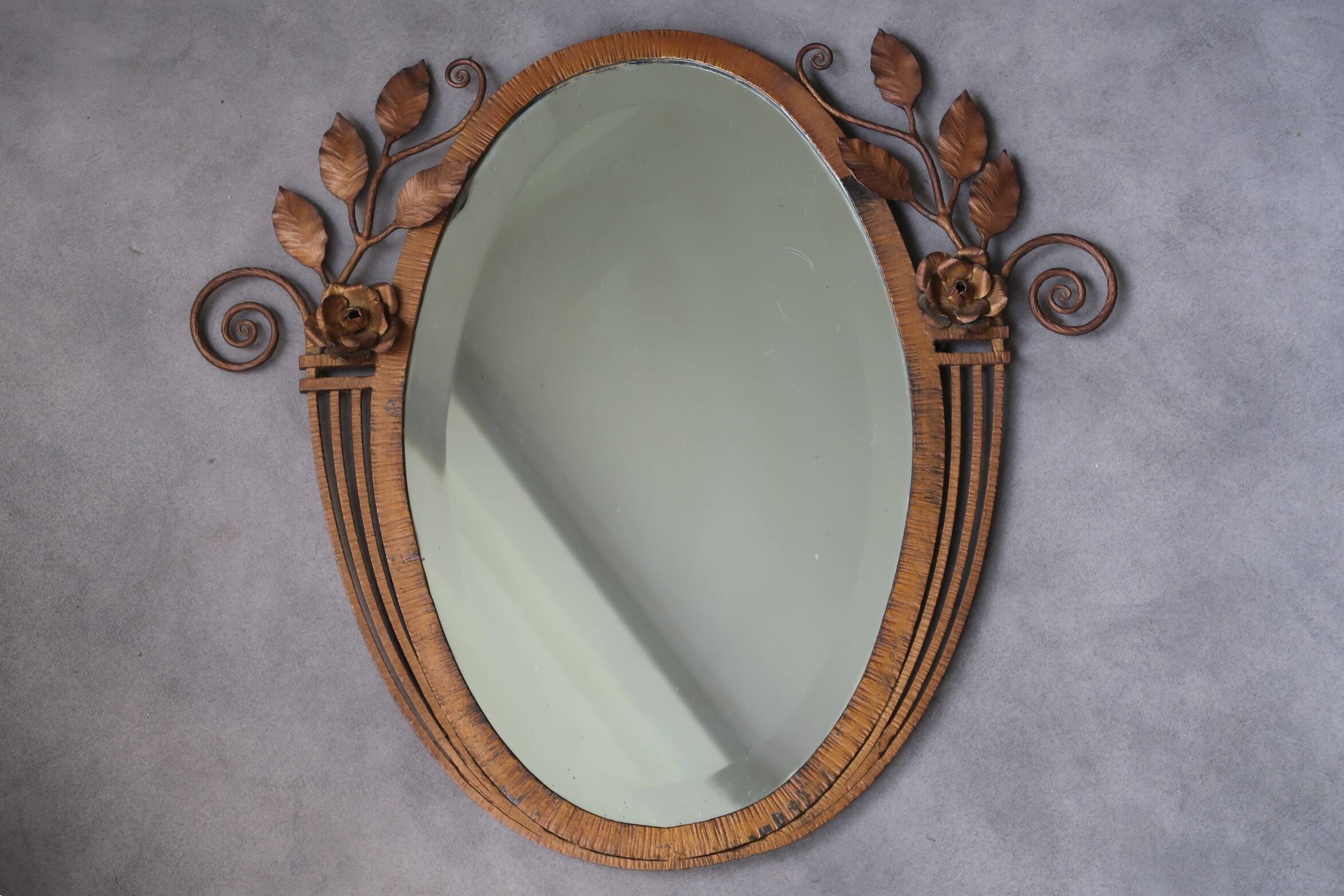 Art Deco mirror from the 1930s in hammered steel.