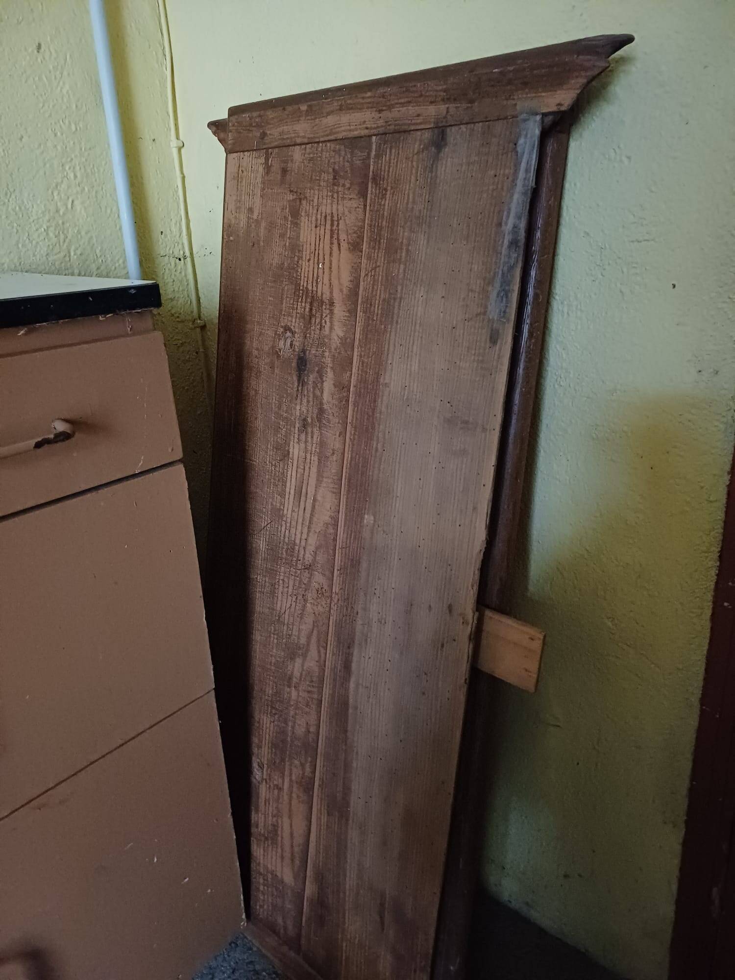 Solid wood dining table with a sculptural base.