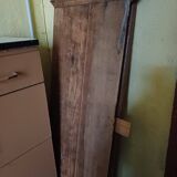 Solid wood dining table with a sculptural base.