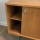 Sideboard with double sliding doors and bar on a metal base
