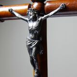 Antique wooden altar crucifix with a turned design and silver-plated Christ.