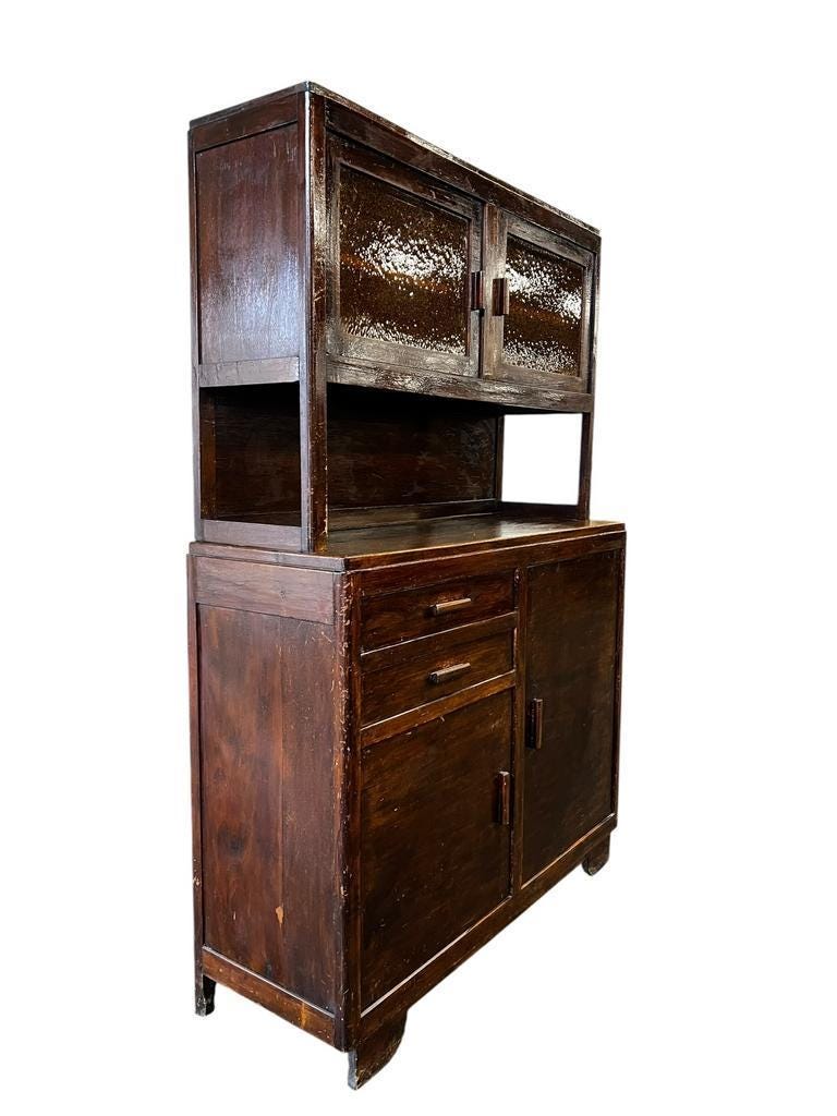 Vintage wooden display cabinet with yellow glass.
