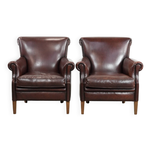 Ensemble de 2 fauteuils en peau de mouton de luxe au look intemporel.