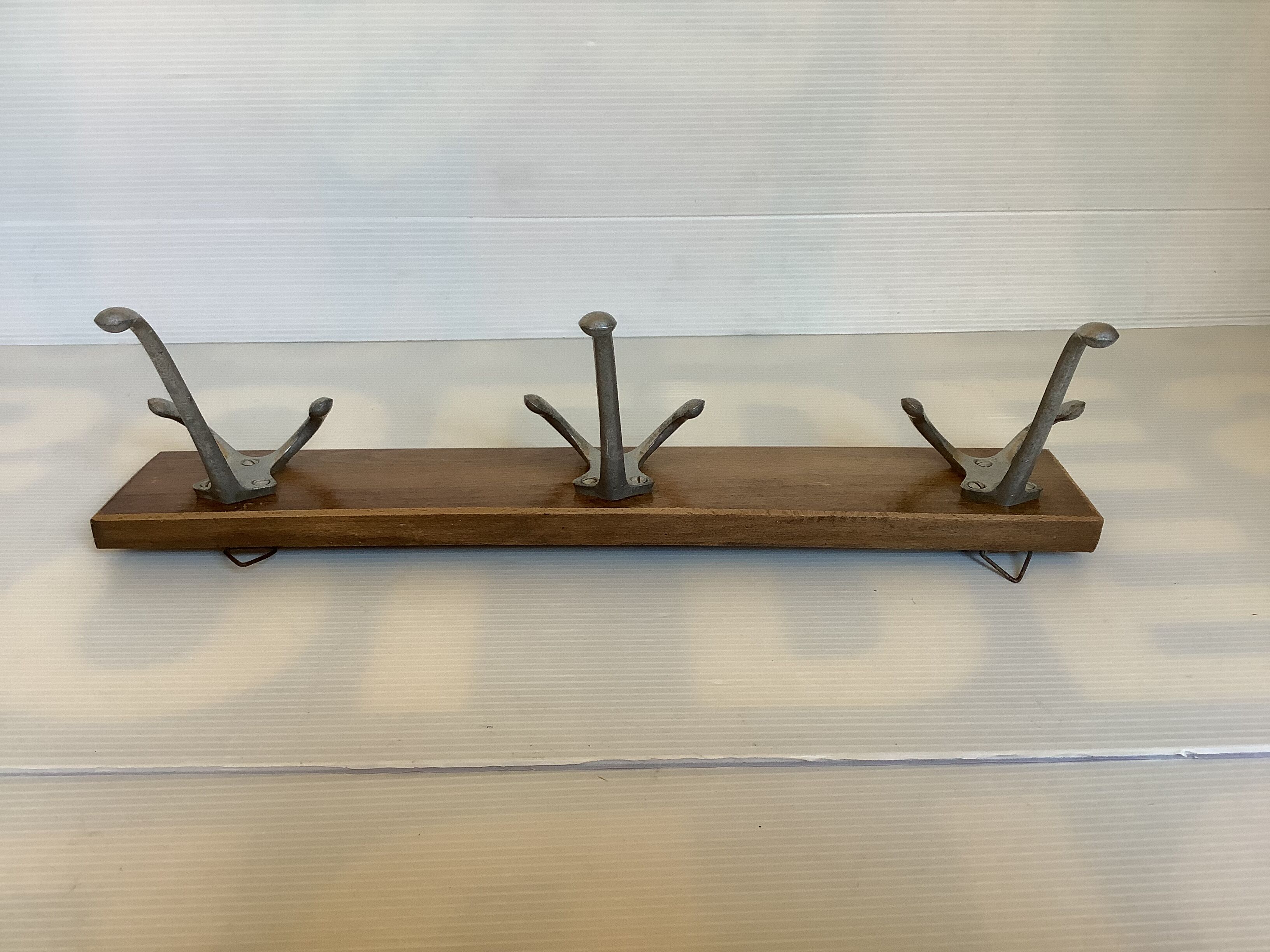 Old coat rack wood metal three hooks