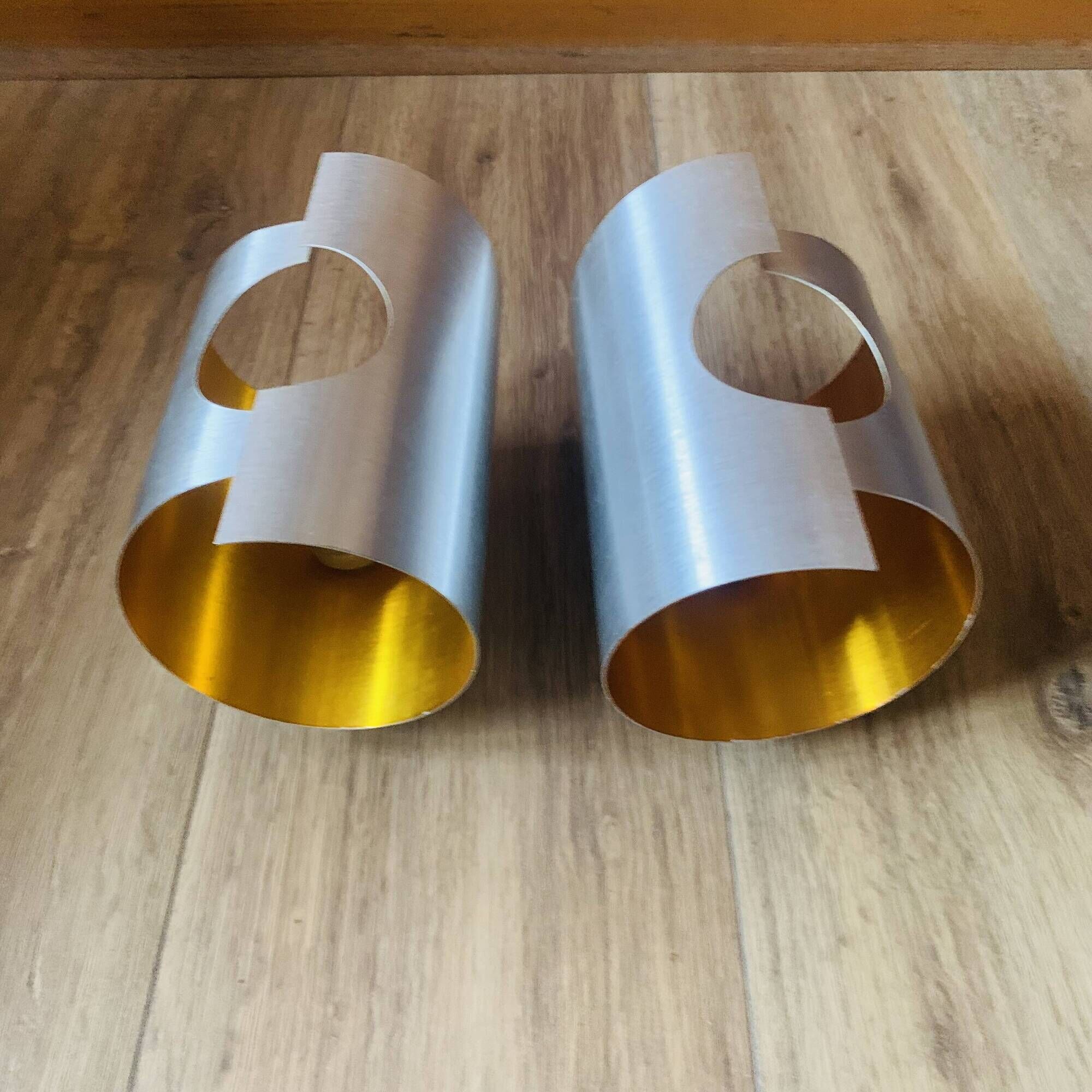 Pair of Space Age wall lights in brushed metal with a copper-orange interior.