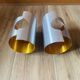 Pair of Space Age wall lights in brushed metal with a copper-orange interior.
