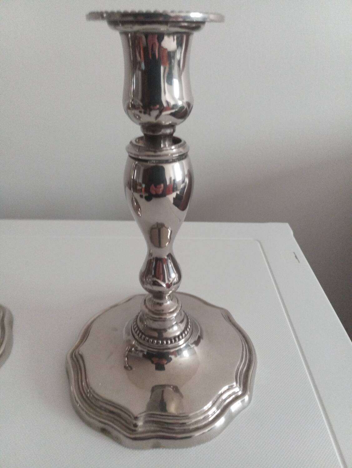Pair of silver-plated metal candlesticks