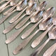Series of 14 Art Deco dessert spoons, silver metal