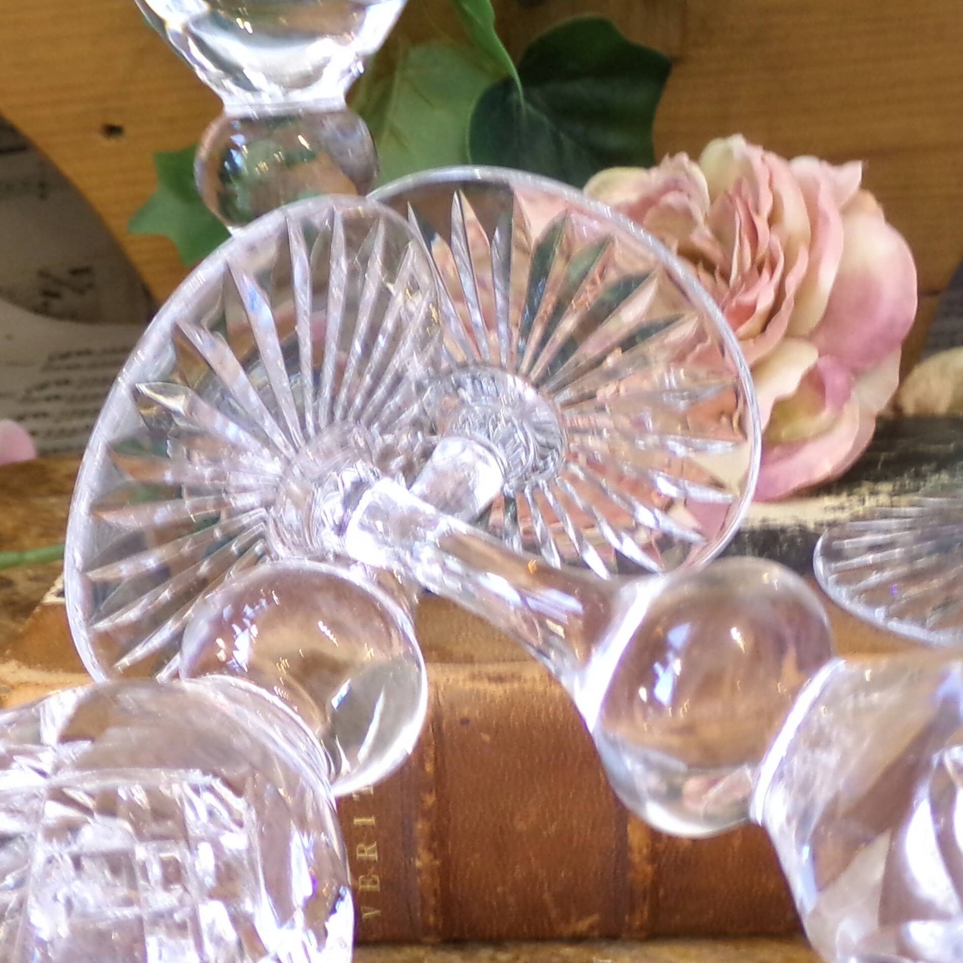 Cut crystal white wine glasses with a slender baluster-shaped stem.