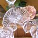 Cut crystal white wine glasses with a slender baluster-shaped stem.