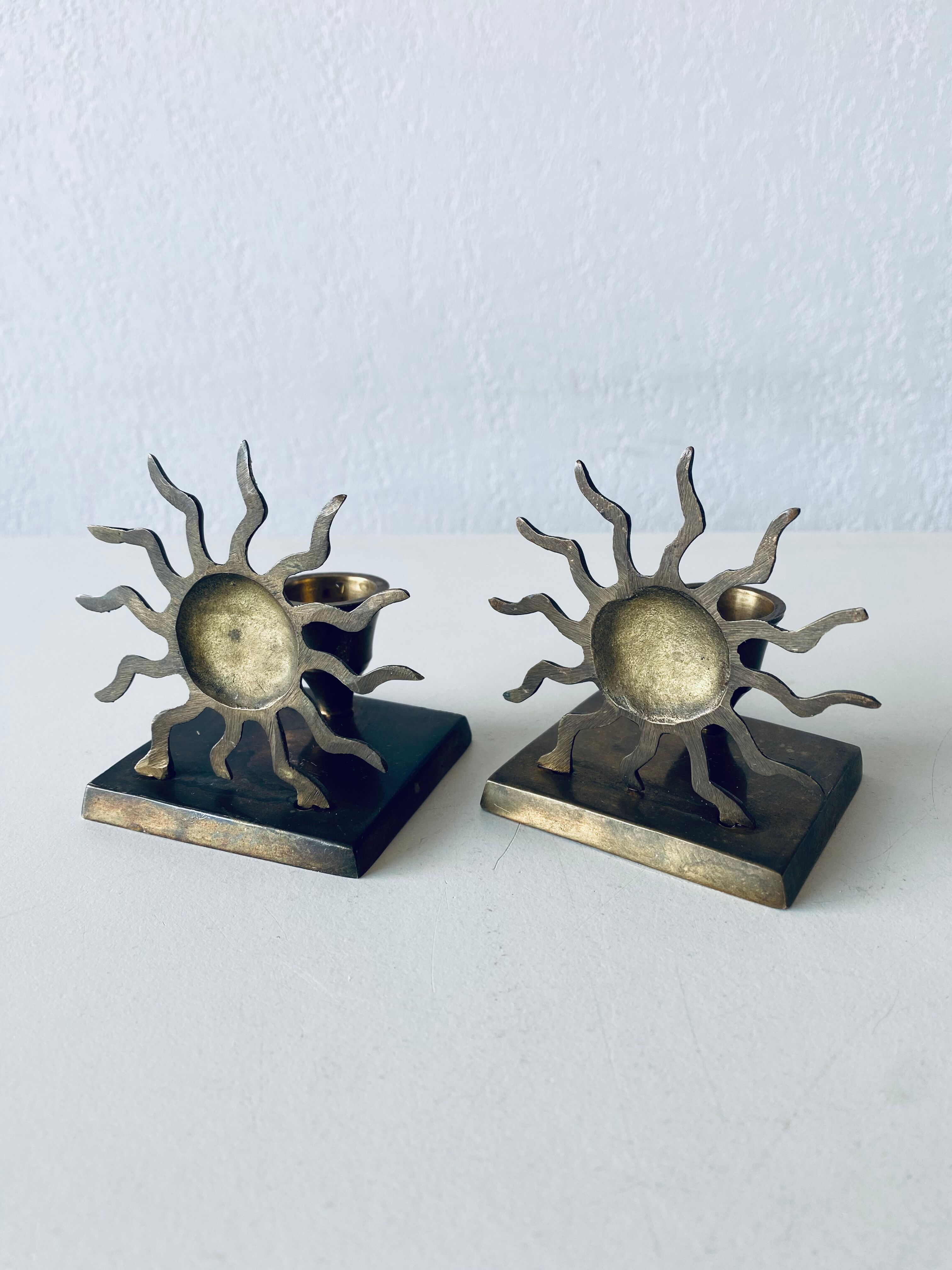 Pair of sun candle holders