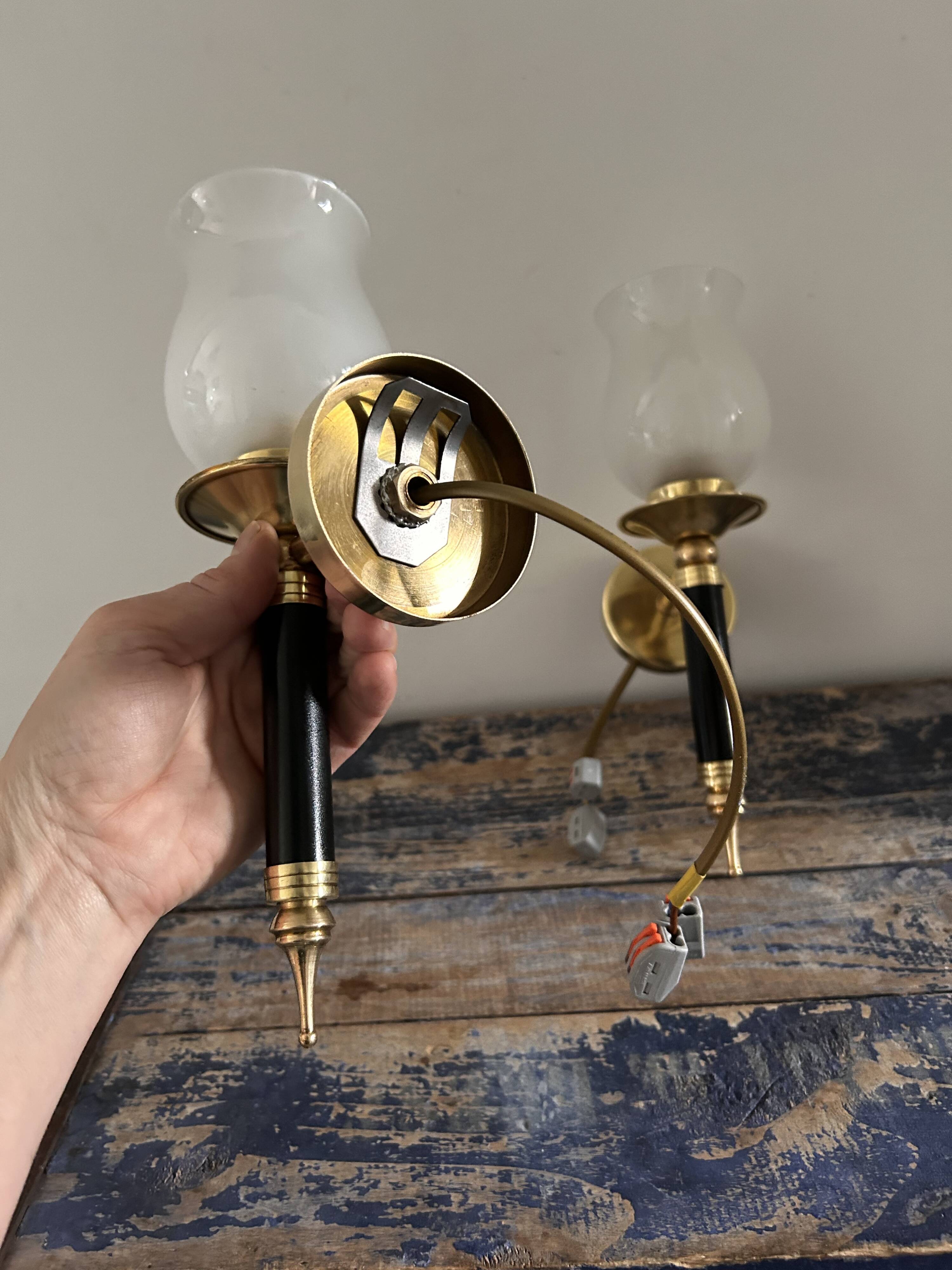 Pair of brass and black torchiere wall lights