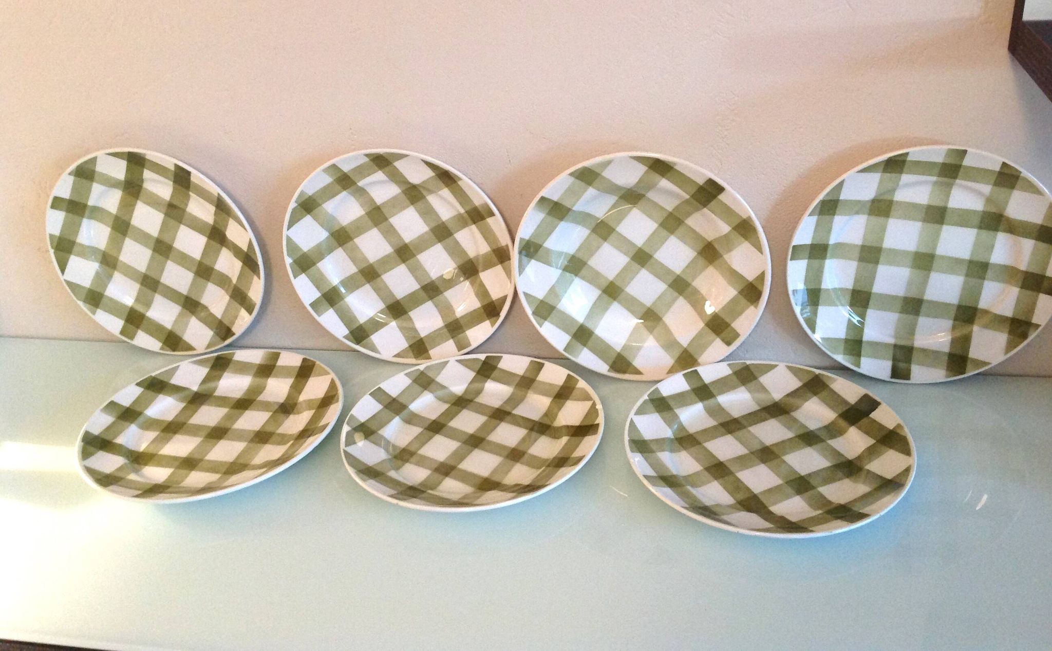 Set of six flat plates and one Moulin des Loups bowl, green tablecloth model/1950s-1960s