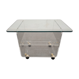 End of sofa with glass and plexiglass wheels from the 70s