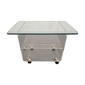 End of sofa with glass and plexiglass wheels from the 70s