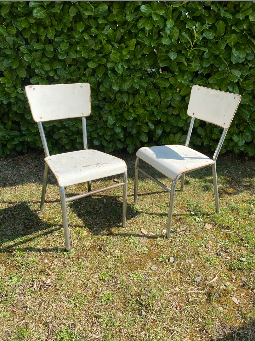 Pair of chairs in patinated white wood and metal structure