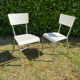 Pair of chairs in patinated white wood and metal structure