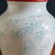 White Ceramic Vase with Peach and Leaf Motifs