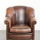 Vintage sheepskin armchair with a unique design and timeless appearance