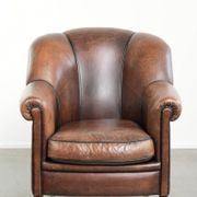 Vintage sheepskin armchair with a unique design and timeless appearance