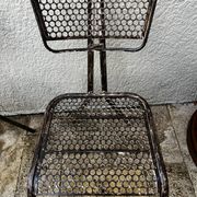 Pairs of perforated metal chairs by René Malaval