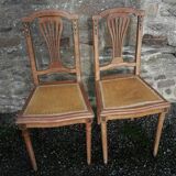 Pair of old chairs with brass elements