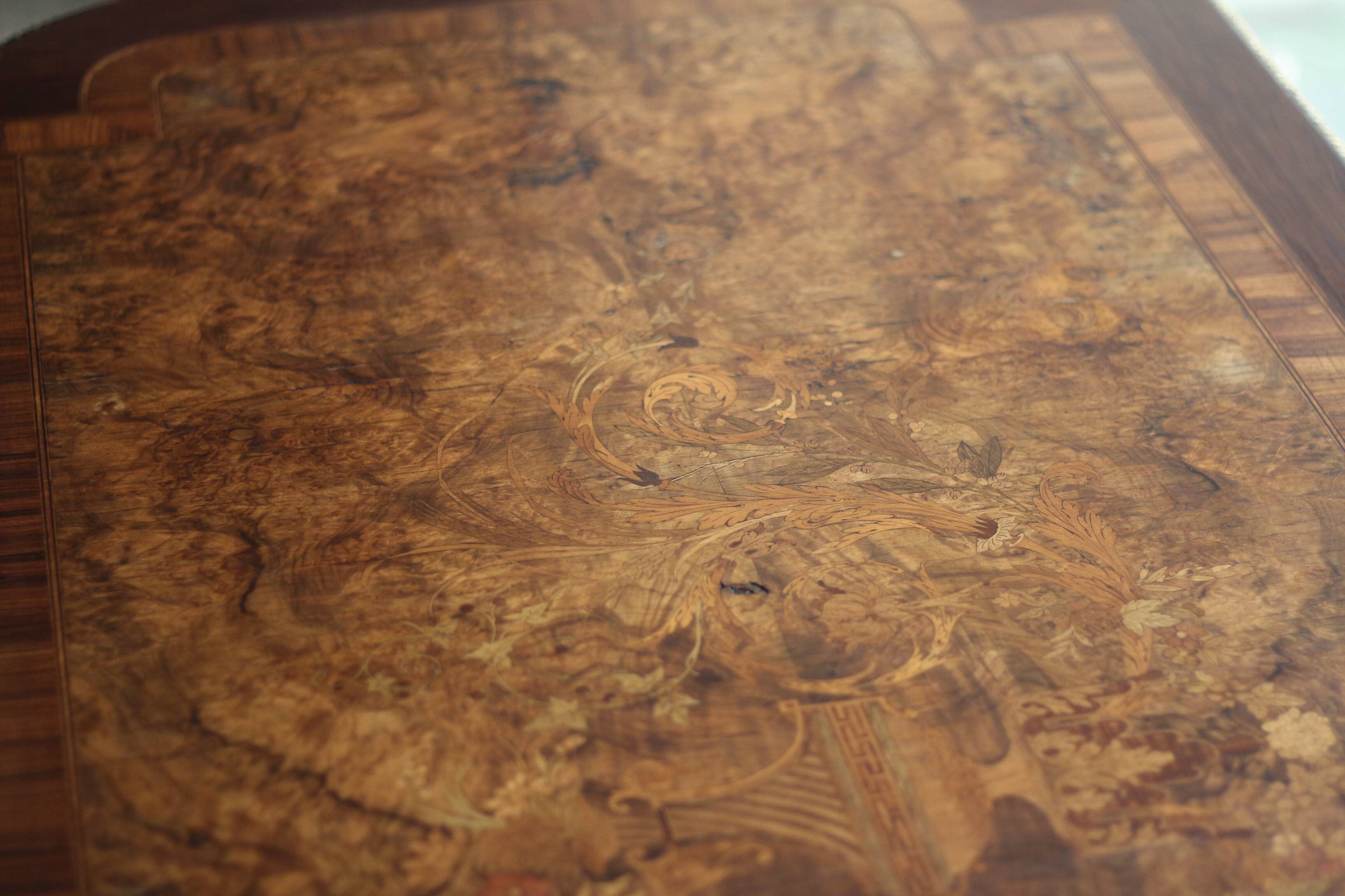 Superb Napoleon III table. Marquetry top and gilded bronzes.