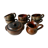 6 cups, 1 sugar bowl and 1 milk pot, made of sandstone by Isabelle Roger and Pierre Bernier